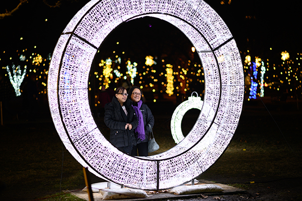 Ladies look through a white light ring