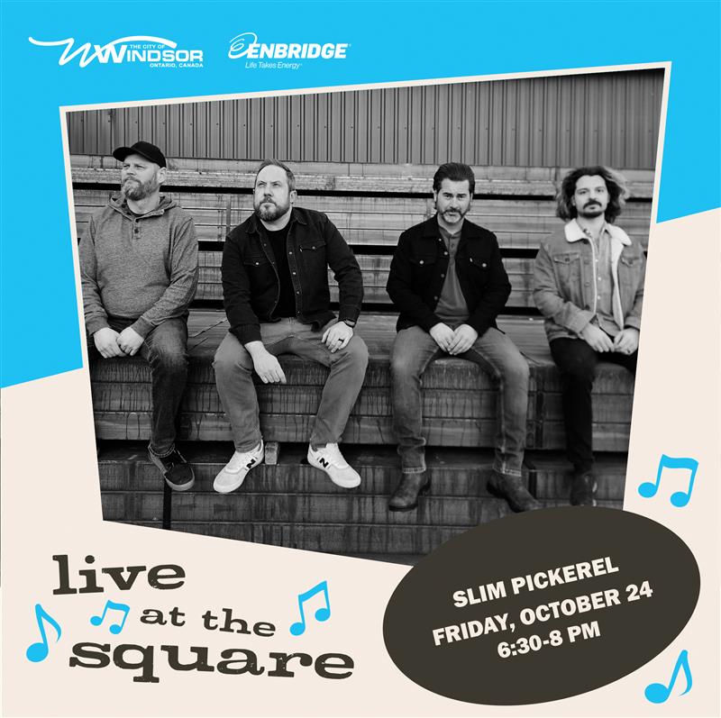 four band members posing together