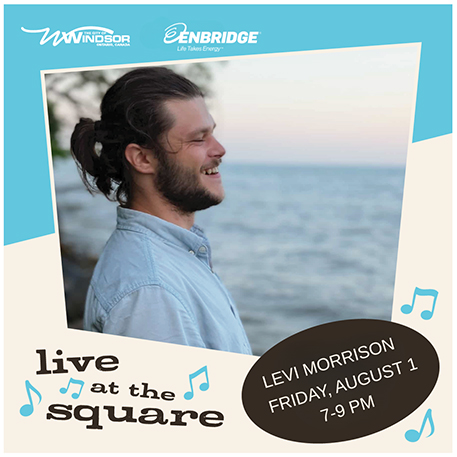 Live at the Square artist Levi Morrison standing on a coastline smiling