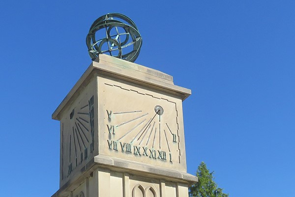 Detail of a bronze sundial and bronze astrolabium.