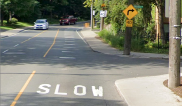 Word, Slow, painted on a road surface